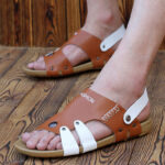 Men's breathable beach shoes on a sandy shore